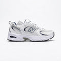 New Balance 530 sneakers feature a white mesh upper accented with navy blue and metallic silver details