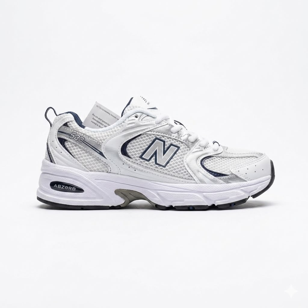 New Balance 530 sneakers feature a white mesh upper accented with navy blue and metallic silver details