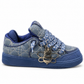 Christian Dior B9S Skater Denim Blue sneaker (designed in collaboration with ERL) featuring a quilted blue denim upper, monogram-patterned laces, and a metal bee charm