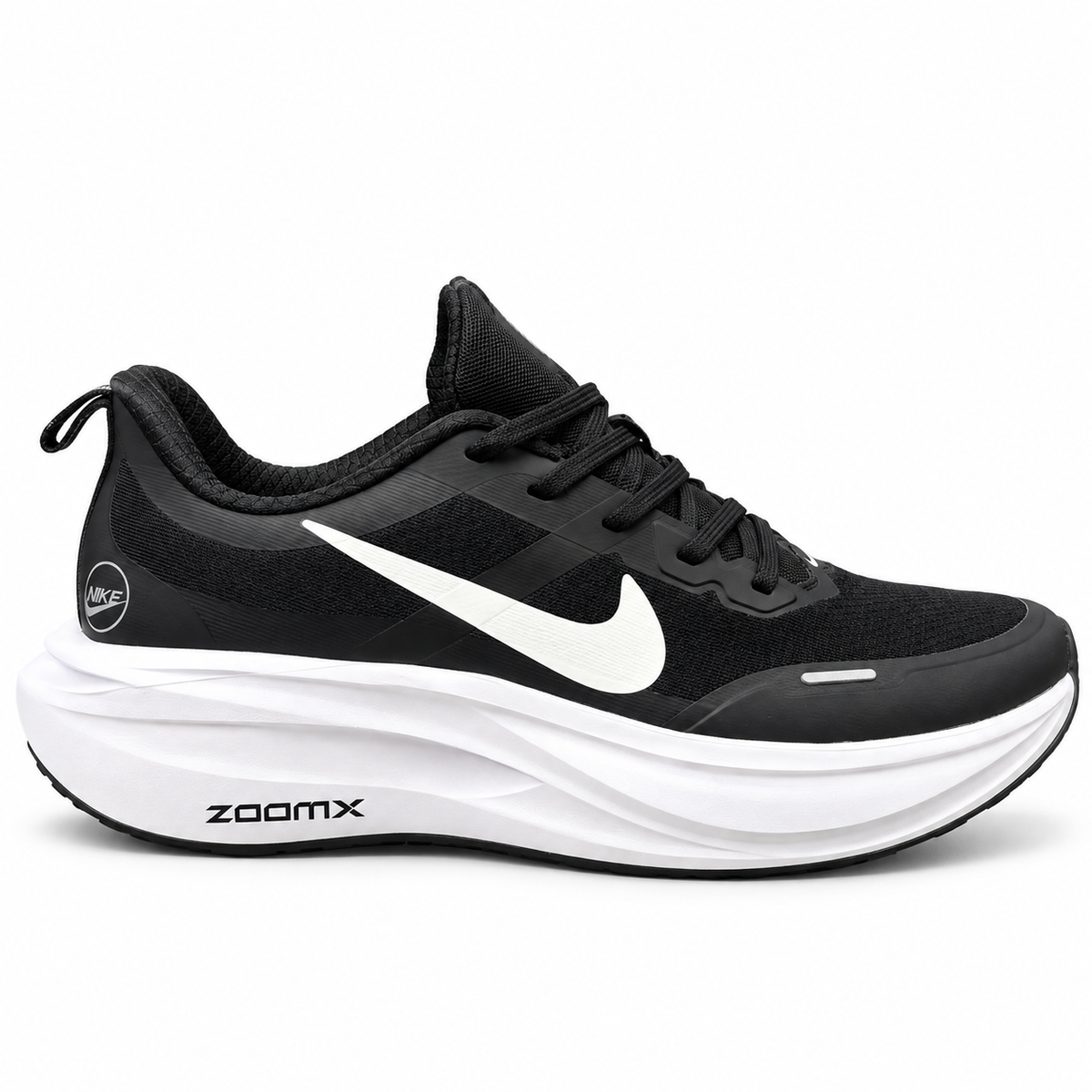 Nike ZoomX black and white cushioned athletic and running sneakers featuring a prominent white Swoosh logo and a thick cushioned ZoomX
