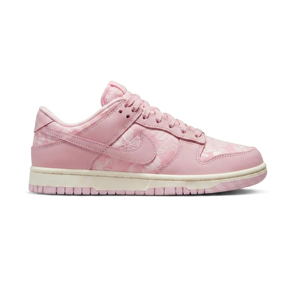 Nike Dunk Low Women's 'Regal Pink' features a delicate floral lace pattern on the overlays
