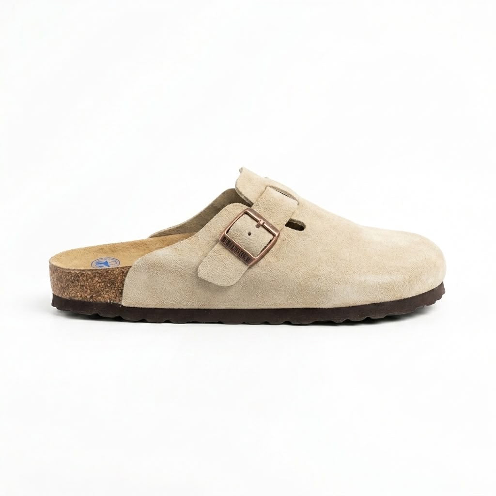Birkenstock Boston clogs are featured in a versatile taupe suede with an adjustable strap
