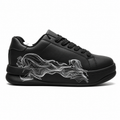 Zara Statement Chunky Trainers, featuring a bold, graphic white line design on the side of a black sneaker.