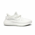 Adidas Yeezy Boost 350 V2 in the "Cream White" or "Triple White" colorway