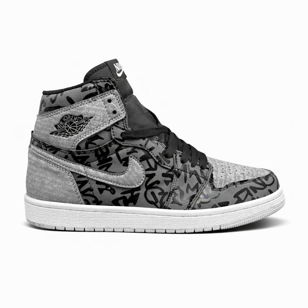 Nike Air Jordan 1 High OG "Rebellionaire" sneaker in a black, white, and particle grey colorway.